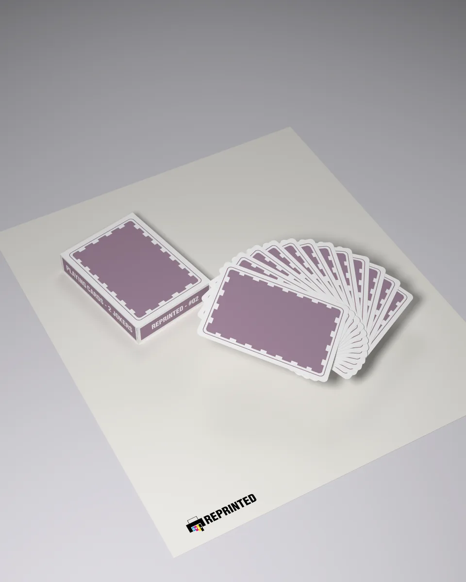 The REPRINTED #02 tuck case lying beside a fan of card backs