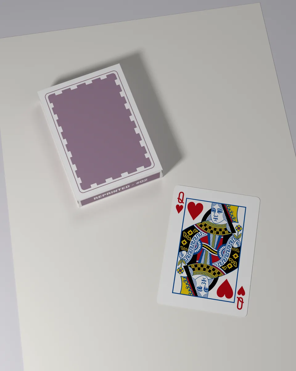 A REPRINTED #02 deck beside the queen of hearts