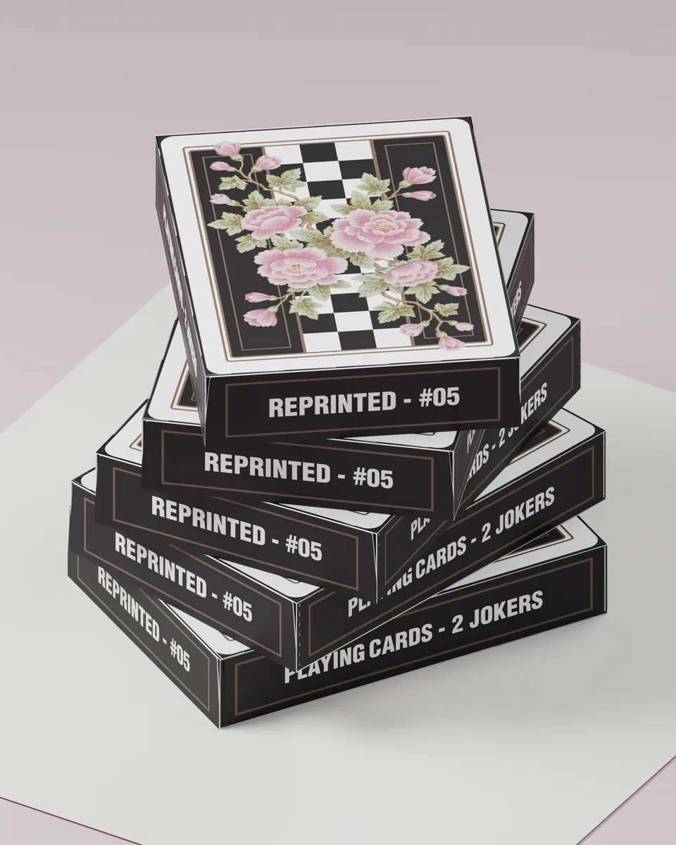 A stack of five REPRINTED #05 tuck cases on white paper